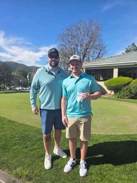 Two golfers showing birdiegum