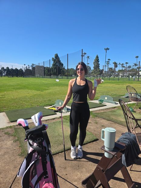 Woman golfer with birdiegum