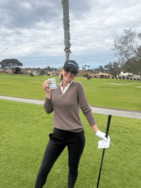 Woman golfer with birdiegum