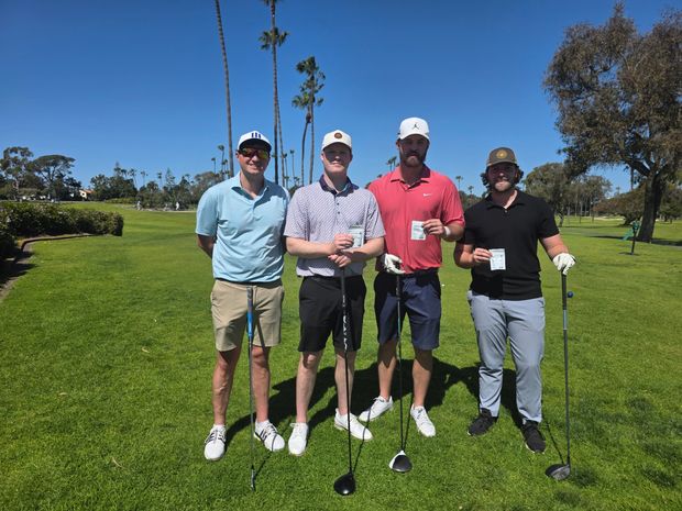 Four golfers on the fairway