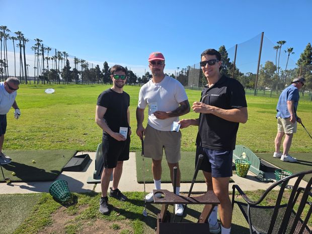 Group of golfers at the driving range